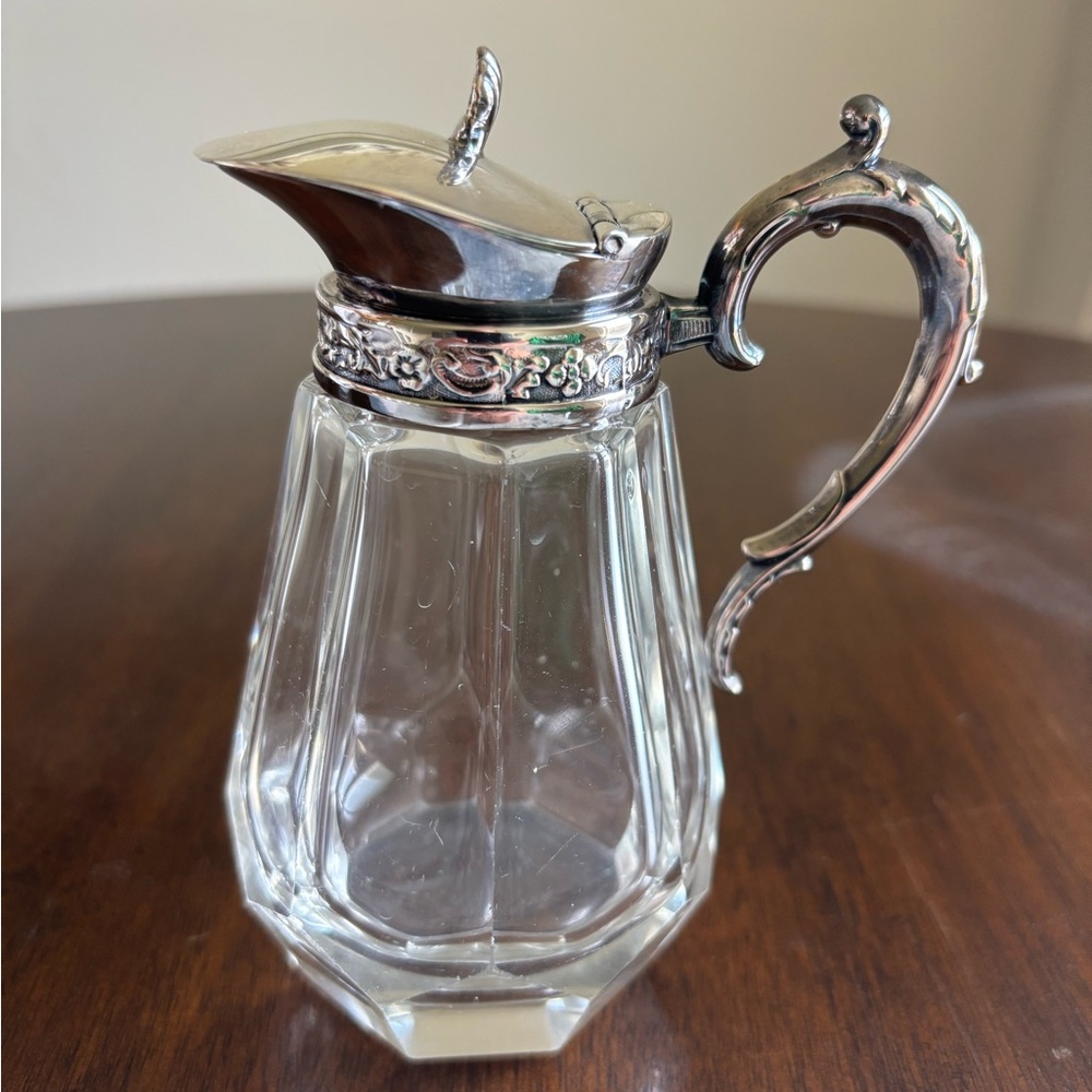 Elegant Silver and Glass Pitcher